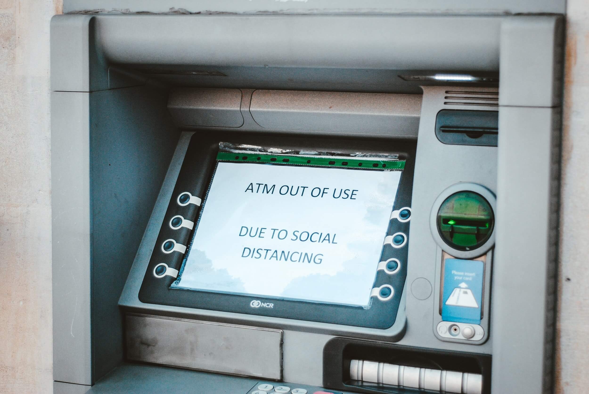 ATM with an out of use sign on it.