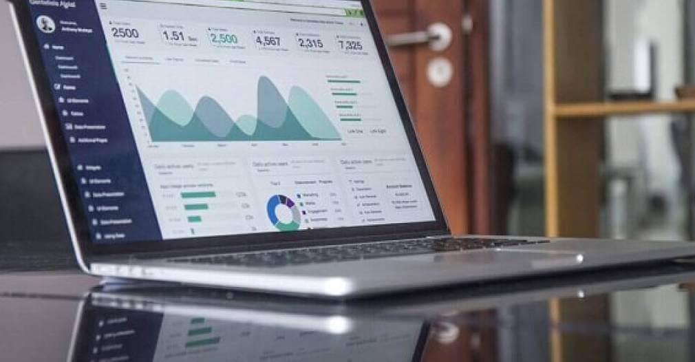 Photo of a graph showing financial changes on a laptop.